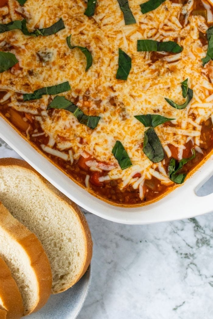 a top down view of the finished dish with slices of bread nearby
